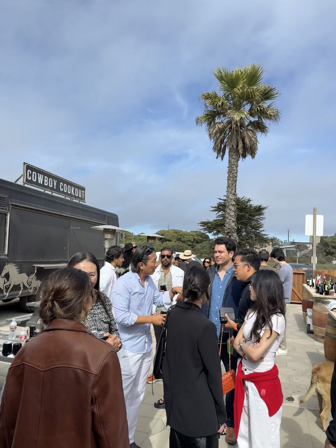 Guests gathered at the Cowboy Cookout truck during a corporate day at the ranch