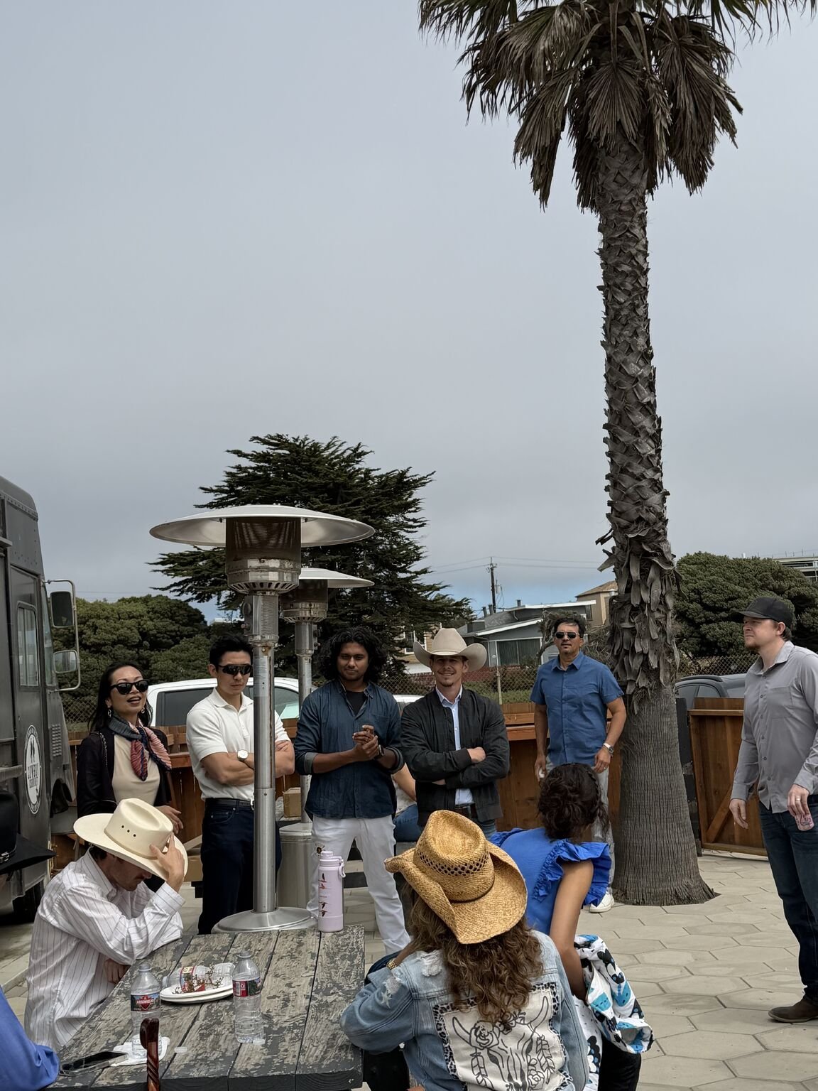 A team briefing on the ranch patio between sessions at Ocean View Stables