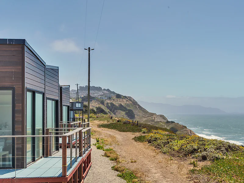 Private pods on the bluff with the ocean beyond