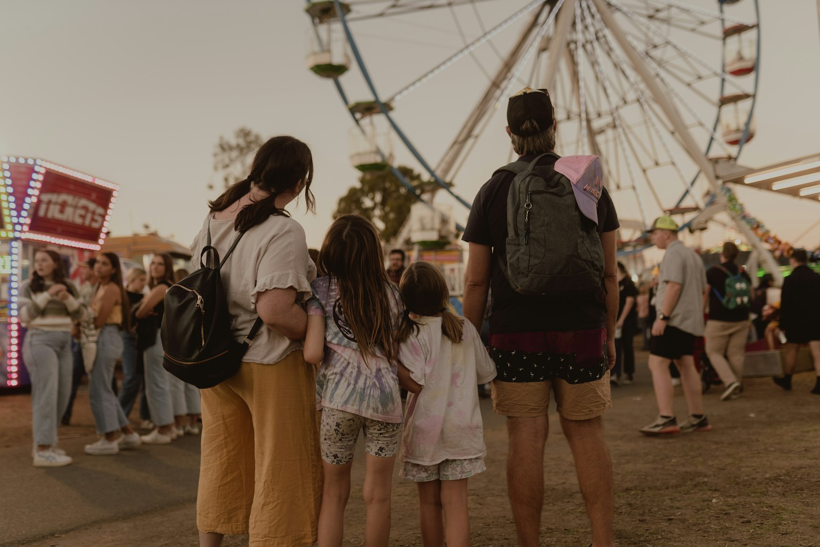 A family walking through a fair